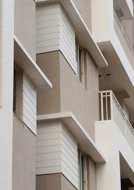A Set of white concrete apartment buildings 